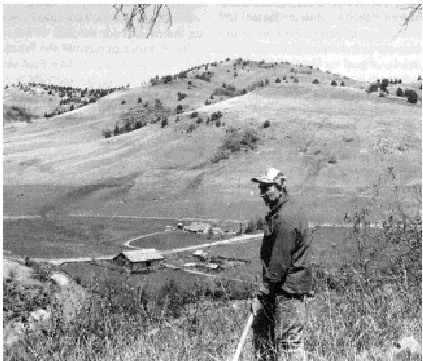 "Paul Luckey with view of Eagle Ranch in background," mid-1990s